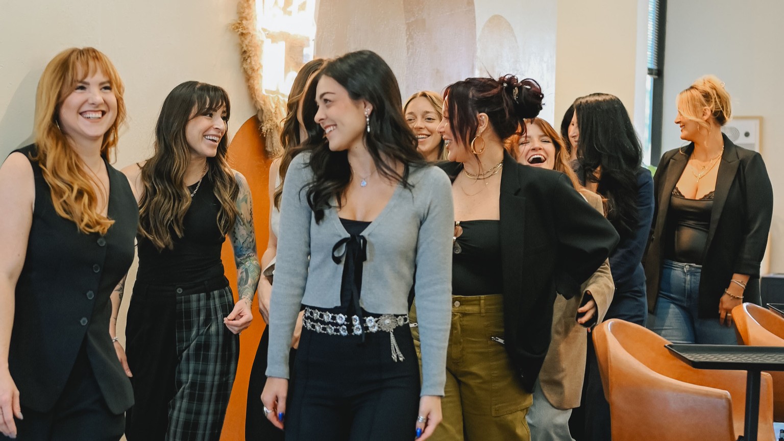 The Painted Mane stylist team laughing together inside their Walnut Creek hair salon